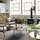 The white ash Rectangular Eames Coffee Table from Herman Miller in a family space. all-groups