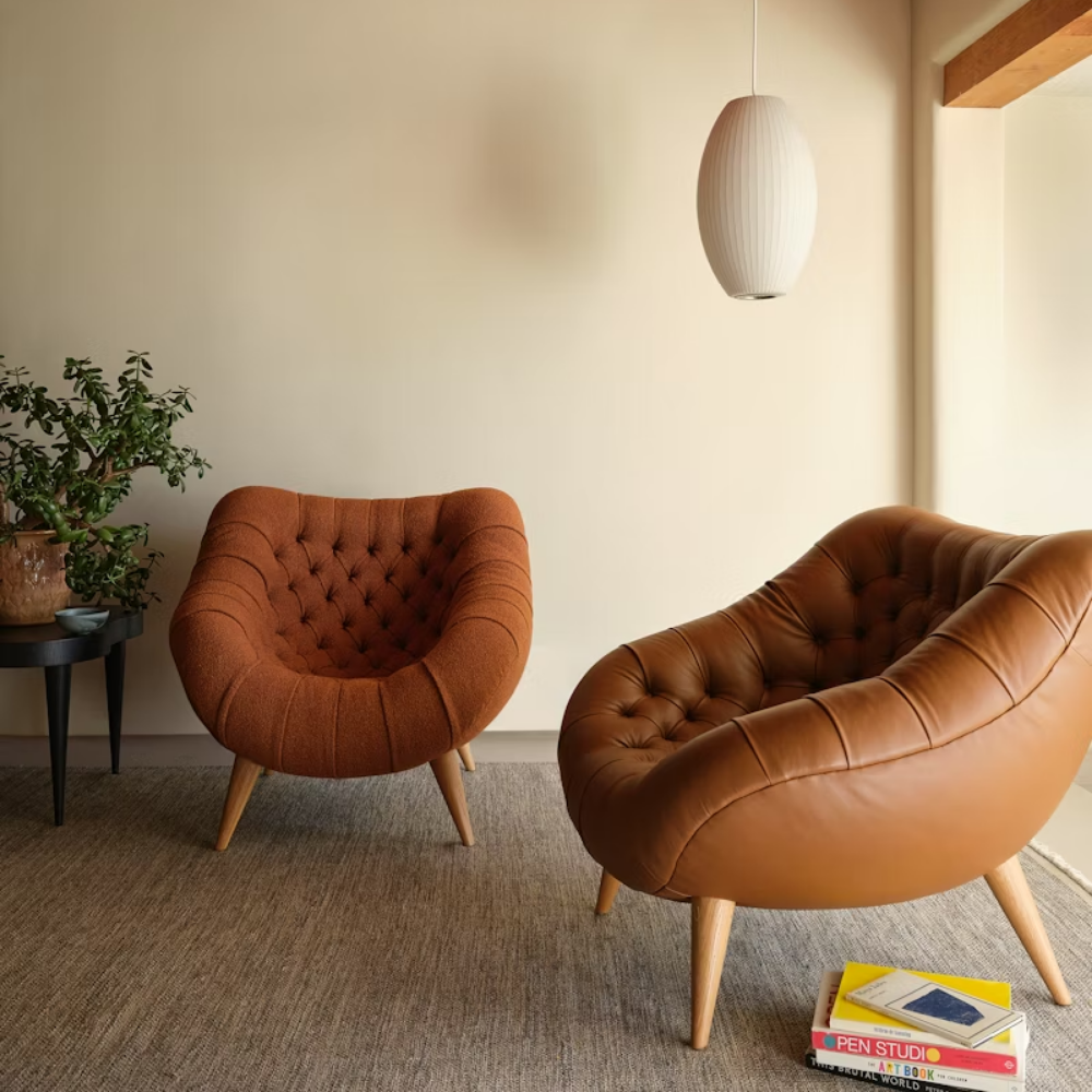 The Rohde Easy Chair from Herman Miller with the bricolage prone leather upholstery and oak leg finish in a living area.