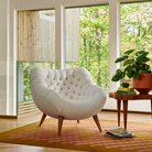 The Rohde Easy Chair from Herman Miller with the brioche luce upholstery in a living room.