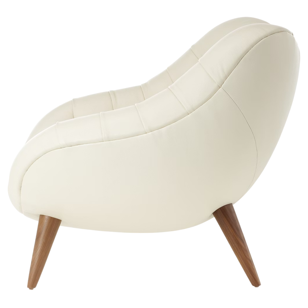 The Rohde Easy Chair from Herman Miller with the lotus prone leather upholstery and walnut leg finish from the side.