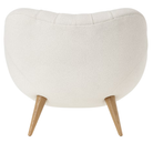 The Rohde Easy Chair from Herman Miller with the warm white whim upholstery and oak leg finish from the back.