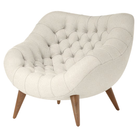 The Rohde Easy Chair from Herman Miller with the warm white whim upholstery and walnut leg finish.