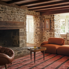 The ebony burl Rohde Paldao Side Table from Herman Miller in a family area.