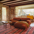 The ebony burl Rohde Paldao Side Table from Herman Miller in a lounge.