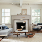 The Square Eames Coffee Table from Herman Miller with the carrara table top and ebony legs in a family area. all-groups