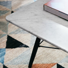 The Square Eames Coffee Table from Herman Miller with the carrara table top and ebony legs in a home office. all-groups