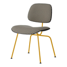 The Upholstered Eames Molded Plastic Dining Chair from Herman Miller with black and white checker upholstery, black shell and marigold leg finish.