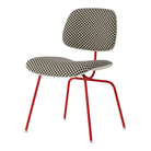 The Upholstered Eames Molded Plastic Dining Chair from Herman Miller with black and white checker upholstery, white shell and blaze leg finish.