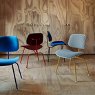 The Upholstered Eames Molded Plastic Dining Chair from Herman Miller options in a living room. all-groups