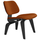 The Upholstered Ebony Eames Molded Plywood Lounge Chair Wood Base from Herman Miller with mode rust upholstery.