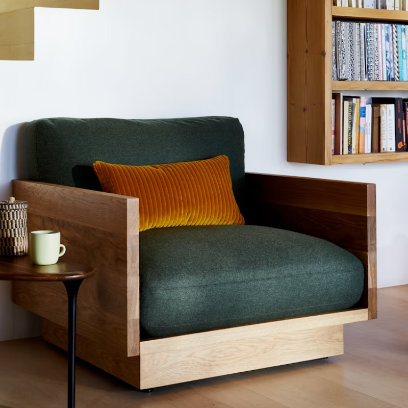 The White Oak Pawson Drift Lounge Chair from Herman Miller with mode outdoors upholstery in a living room. all-groups