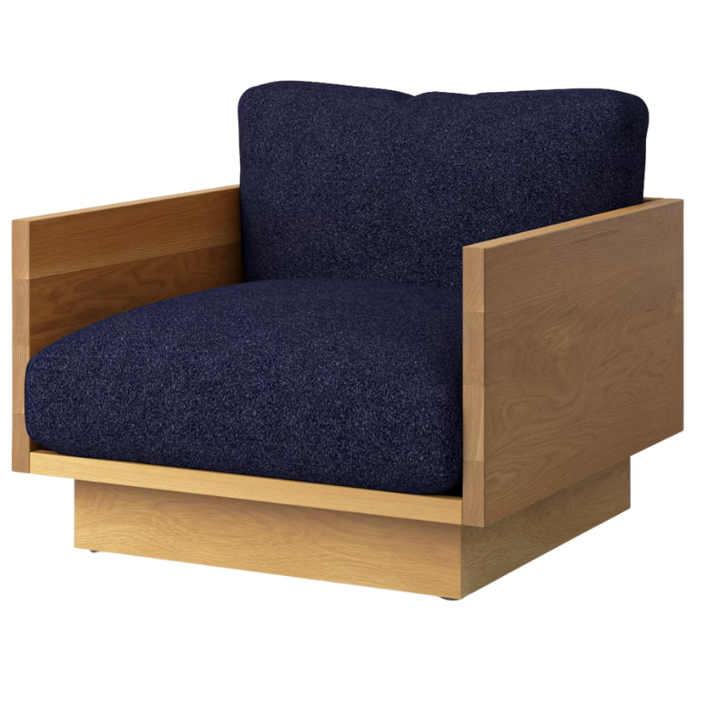 The White Oak Pawson Drift Lounge Chair from Herman Miller with whim navy upholstery.