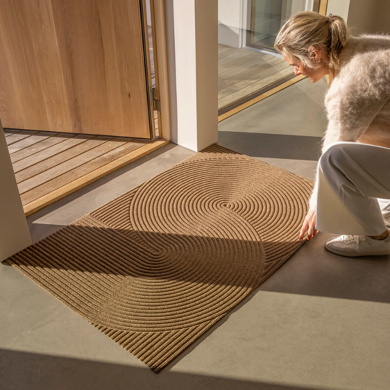 The Sand Doormat from Heymat in a living space lifestyle shot.