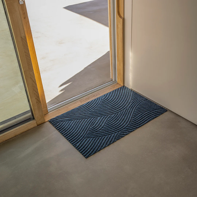 The Sjø Doormat from Heymat in the small size in an entryway.