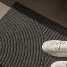 The Stein Doormat from Heymay in a living room.