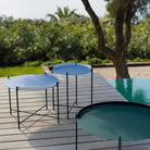 The Edge Outdoor Tray Side Table and Edge Tray Coffee Table in Medium and large by Houe on a patio. all-groups