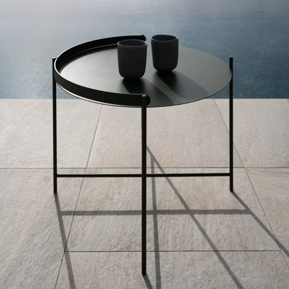 The Edge Tray Coffee Table, Medium in Olive Green on a pool deck.