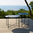 The Edge Outdoor Tray Side Table and Edge Tray Coffee Table in Medium by Houe on a patio. all-groups