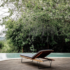 The Molo Sunbed by Houe with cushion upright.