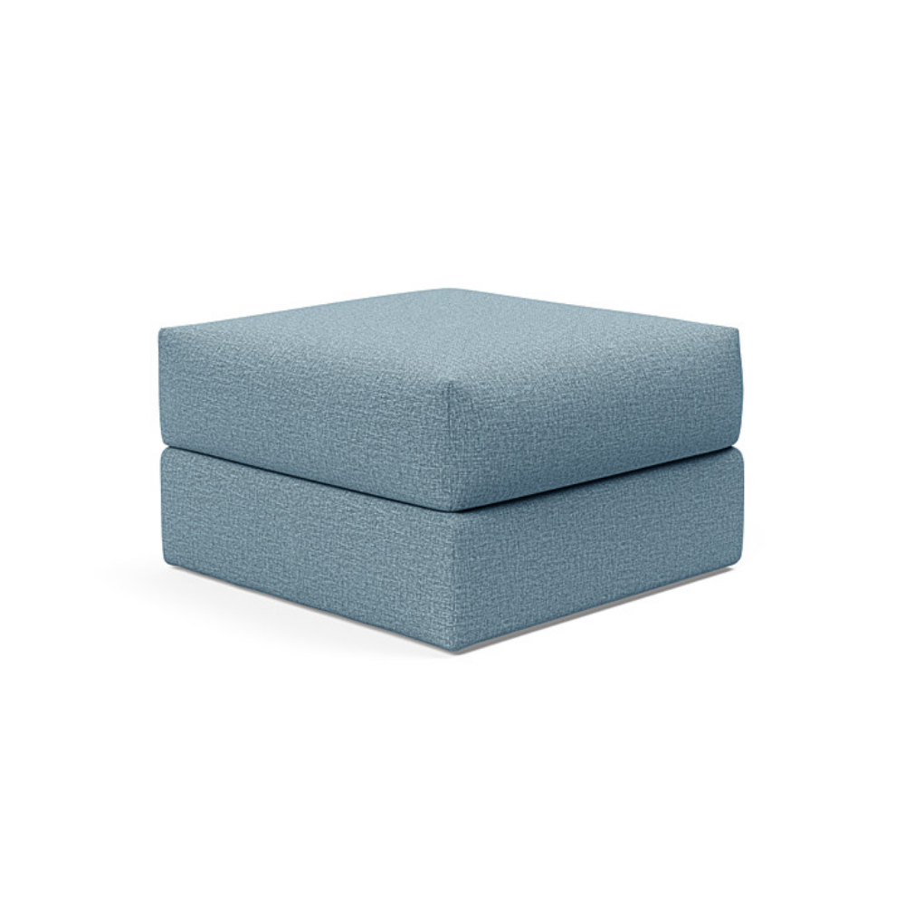 The Cornila Ottoman from Innovation Living with mixed dance light blue 525 upholstery.