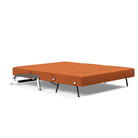 The Cubed Queen Size Sleeper Sofa with Chrome Legs from Innovation Living with esina rust orange 412 upholstery setup as a bed.