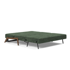 The Cubed Queen Size Sleeper Sofa with Wood Legs from Innovation Living with dark lacquered oak legs and avella pine green 281 upholstery setup as a bed.