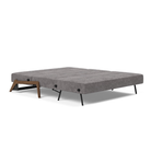 The Cubed Queen Size Sleeper Sofa with Wood Legs from Innovation Living with dark lacquered oak legs and avella warm grey 282 upholstery setup as a bed.