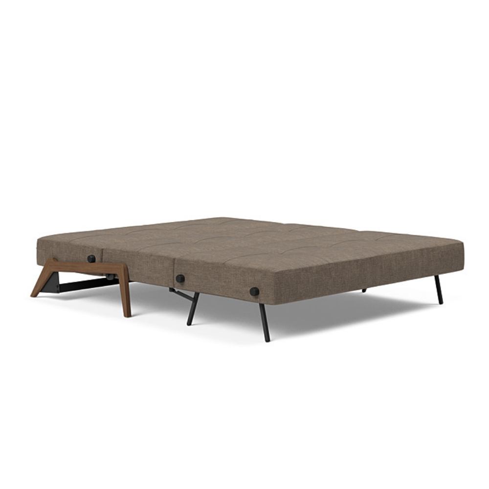 The Cubed Queen Size Sleeper Sofa with Wood Legs from Innovation Living with dark lacquered oak legs and esina cedar brown 411 upholstery setup as a bed.