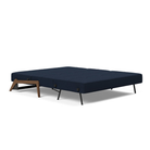The Cubed Queen Size Sleeper Sofa with Wood Legs from Innovation Living with dark lacquered oak legs and mixed dance blue 528 upholstery setup as a bed.