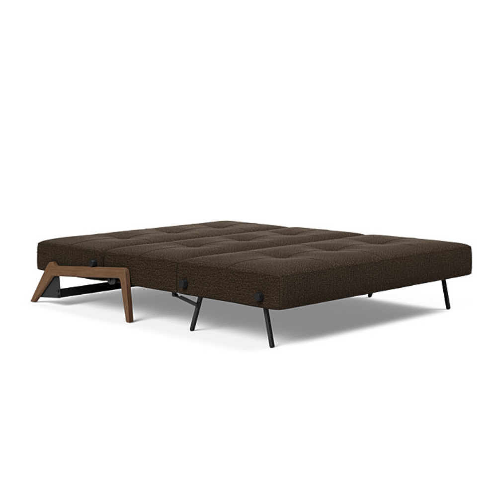 The Cubed Queen Size Sleeper Sofa with Wood Legs from Innovation Living with dark lacquered oak legs and taura chocco 358 upholstery setup as a bed.