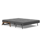 The Cubed Queen Size Sleeper Sofa with Wood Legs from Innovation Living with dark lacquered oak legs and taura deep grey 350 upholstery setup as a bed.