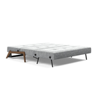 The Cubed Queen Size Sleeper Sofa with Wood Legs from Innovation Living with dark lacquered oak legs and taura slate grey 351 upholstery setup as a bed.