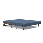 The Cubed Queen Size Sleeper Sofa with Wood Legs from Innovation Living with dark lacquered oak legs and weda blue 302 upholstery setup as a bed.