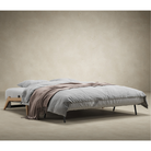 The Cubed Queen Size Sleeper Sofa with Wood Legs from Innovation Living with lacquered oak legs set up as a bed. all-groups