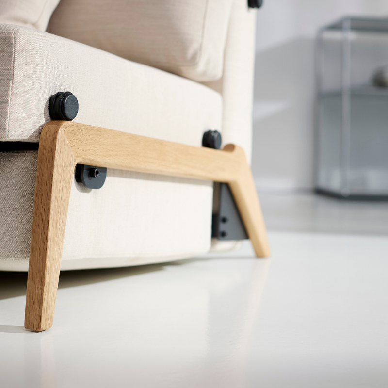 The Cubed Queen Size Sleeper Sofa with Wood Legs from Innovation Living with lacquered oak legs and blida sand grey 612 upholstery in a lounge.