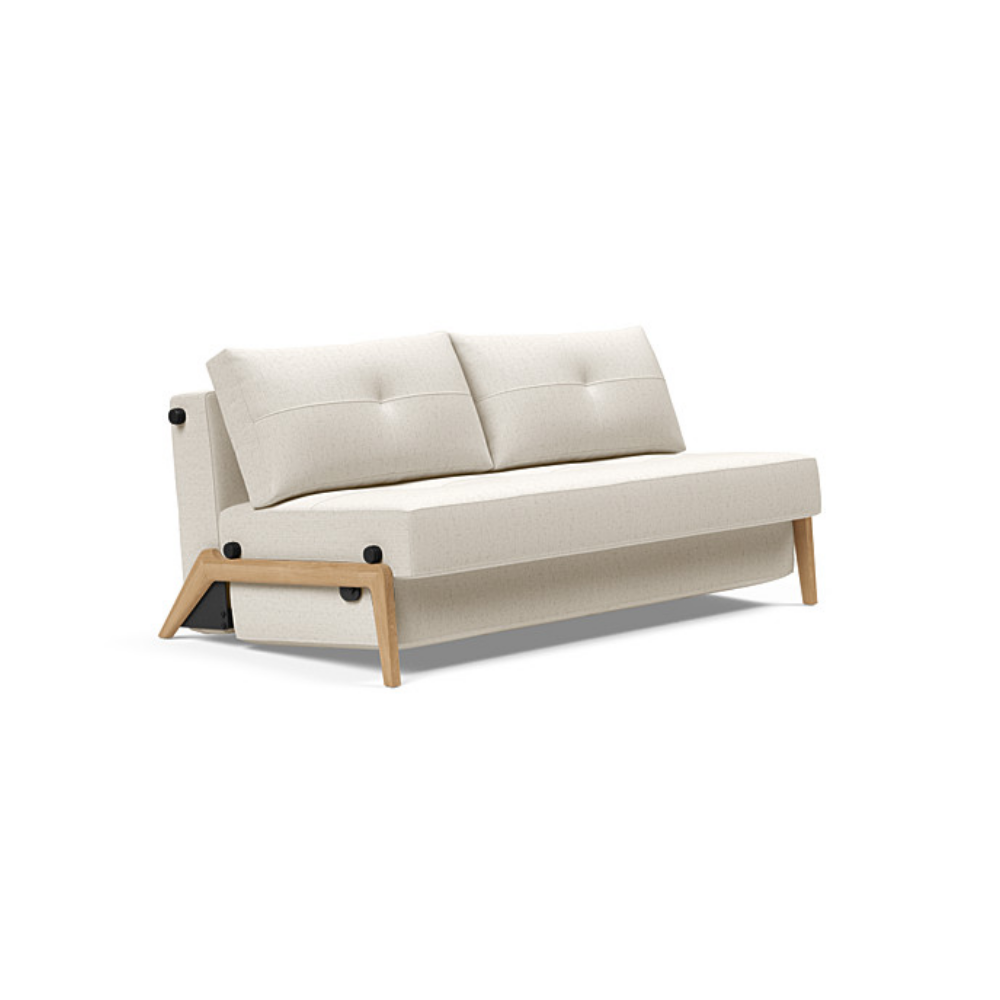 The Cubed Queen Size Sleeper Sofa with Wood Legs from Innovation Living with lacquered oak legs and boucle off white 531 upholstery setup as a sofa.