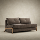 The Cubed Queen Size Sleeper Sofa with Wood Legs from Innovation Living with lacquered oak legs and esina cedar brown 411 upholstery from the side in a living space.