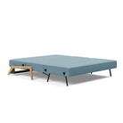 The Cubed Queen Size Sleeper Sofa with Wood Legs from Innovation Living with lacquered oak legs and mixed dance light blue 525 upholstery setup as a bed.