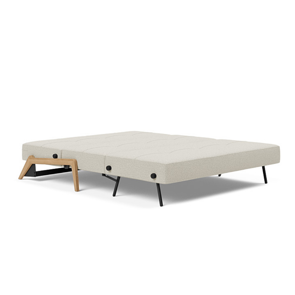 The Cubed Queen Size Sleeper Sofa with Wood Legs from Innovation Living with lacquered oak legs and mixed dance natural 527 upholstery setup as a bed.