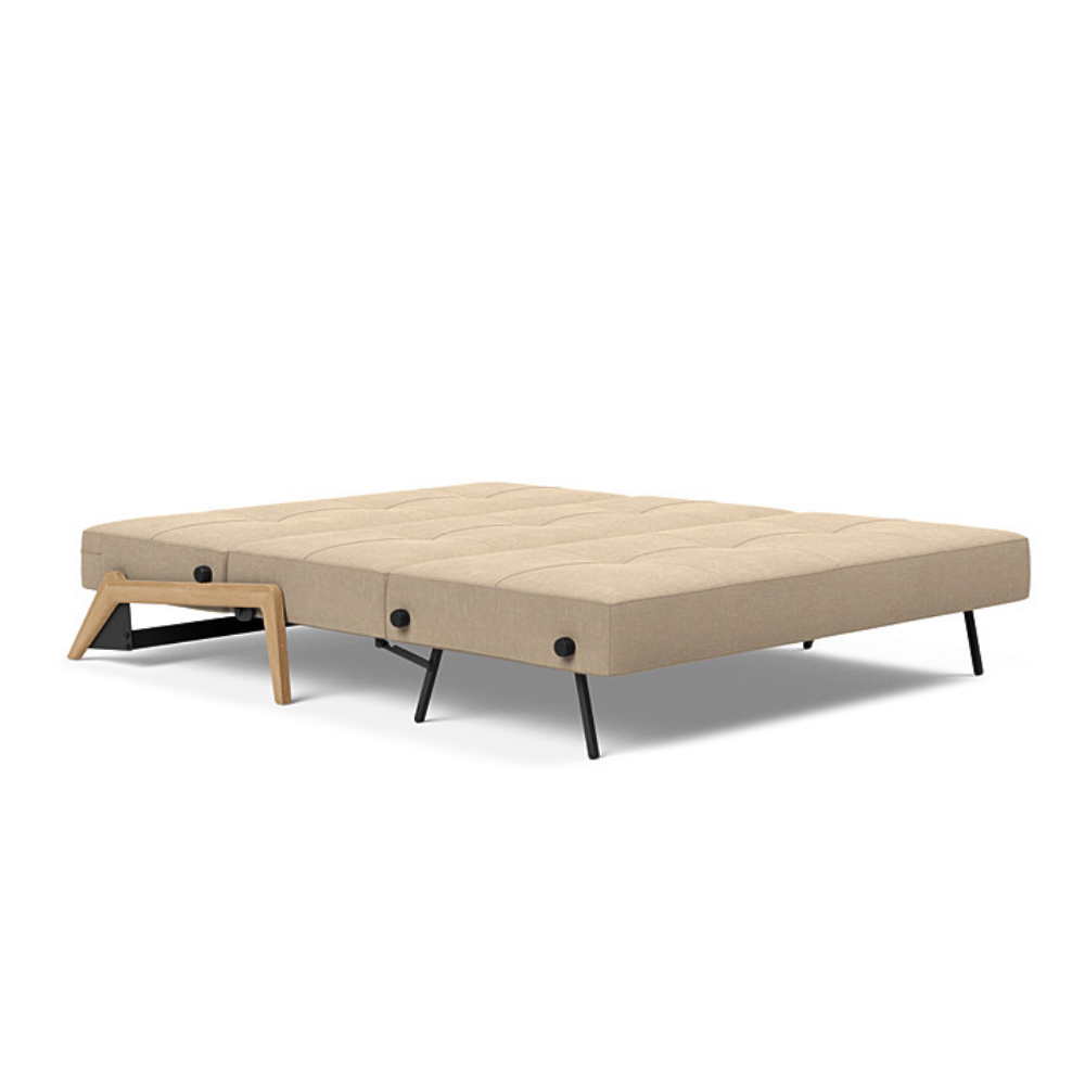The Cubed Queen Size Sleeper Sofa with Wood Legs from Innovation Living with lacquered oak legs and phobos mocha 587 upholstery setup as a bed.