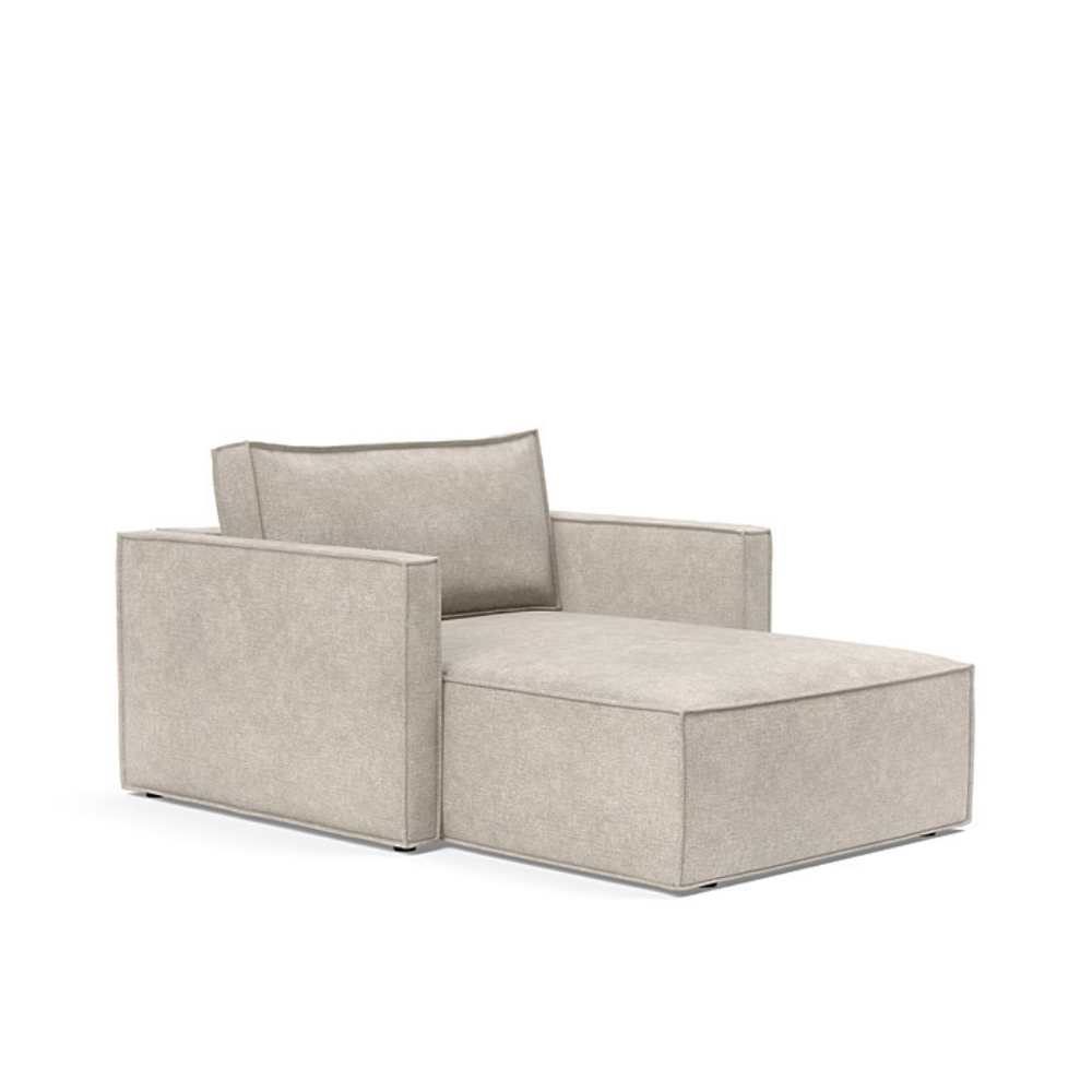 The Newilla Lounger Chair with Slim Arms with avella sand 280 upholstery setup as a lounge chair.
