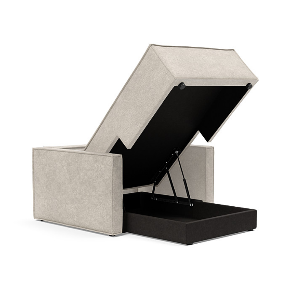 The Newilla Lounger Chair with Slim Arms with avella sand 280 upholstery open showing the integrated storage.