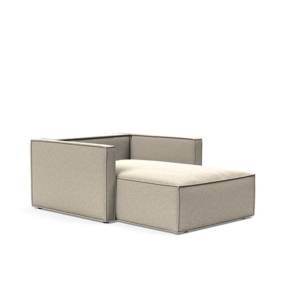 The Newilla Lounger Chair with Slim Arms with boucle beige 539 upholstery without the cushion, setup as a bed.