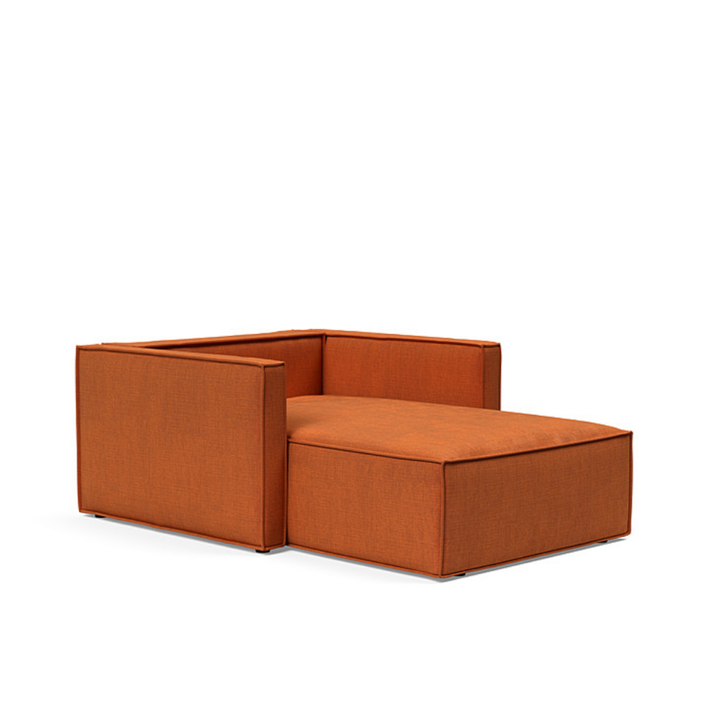 The Newilla Lounger Chair with Slim Arms with esina rust orange 412 upholstery without the cushion, setup as a bed.