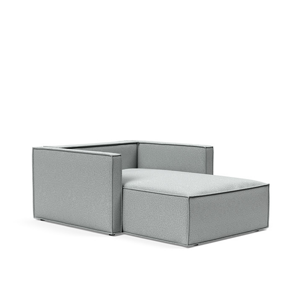 The Newilla Lounger Chair with Slim Arms with melange light grey 538 upholstery without the cushion, setup as a bed.