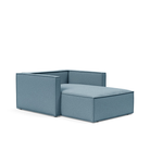 The Newilla Lounger Chair with Slim Arms with mixed dance light blue 525 upholstery without the cushion, setup as a bed.