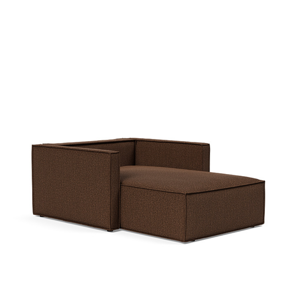The Newilla Lounger Chair with Slim Arms with taura cappuccino 359 upholstery without the cushion, setup as a bed.