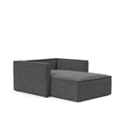 The Newilla Lounger Chair with Slim Arms with taura deep grey 350 upholstery without the cushion, setup as a bed.