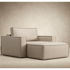 The Newilla Lounger Chair with Standard Arms from Innovation Living with adario taupe 257 upholstery from an angle in a living space. all-groups