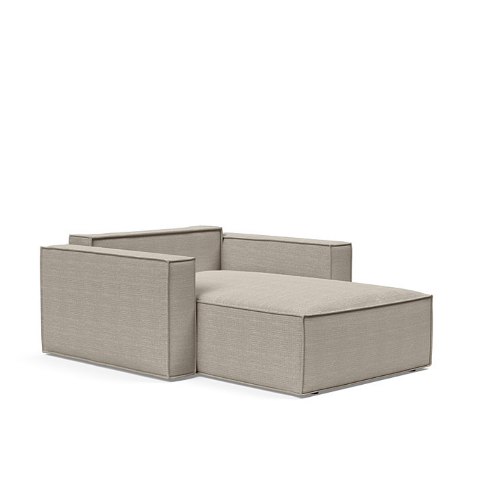 The Newilla Lounger Chair with Standard Arms from Innovation Living with kenya gravel 579 upholstery setup as a bed with the cushion removed.